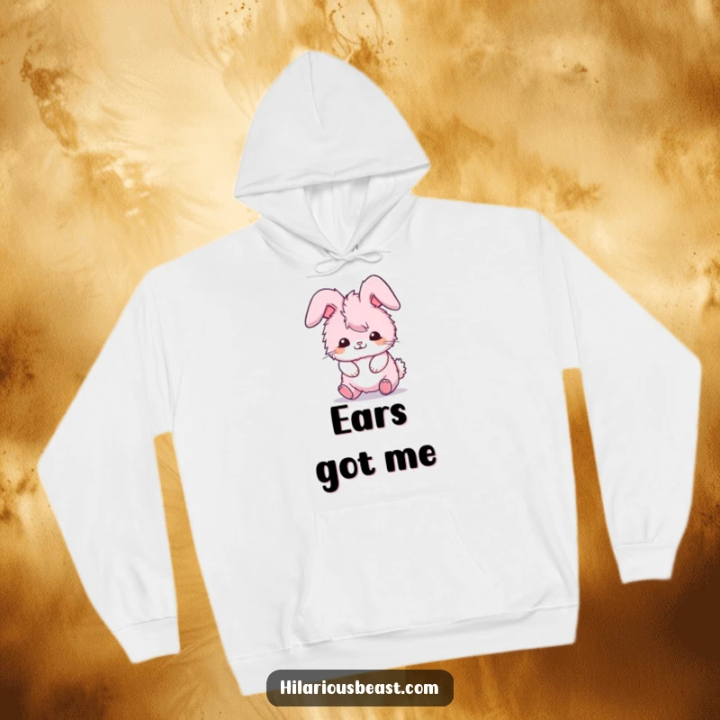 Funny hoodie depicting a fluffy pink bunny comically tripping over its own ears, a cozy funny gift.