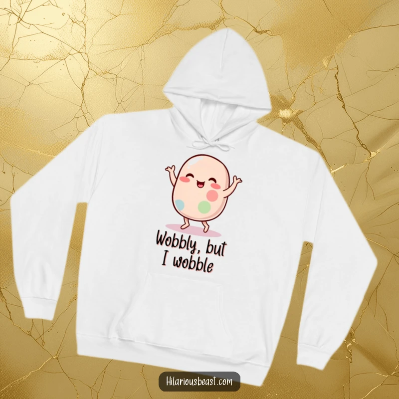 Funny hoodie showcasing a plump, wobbly jelly bean character engaged in a hilarious, energetic silly dance, perfect for cozy laughs.