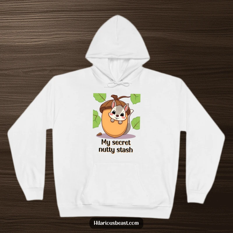Funny hoodie featuring a shy squirrel peeking with a smirk from behind an oversized acorn.