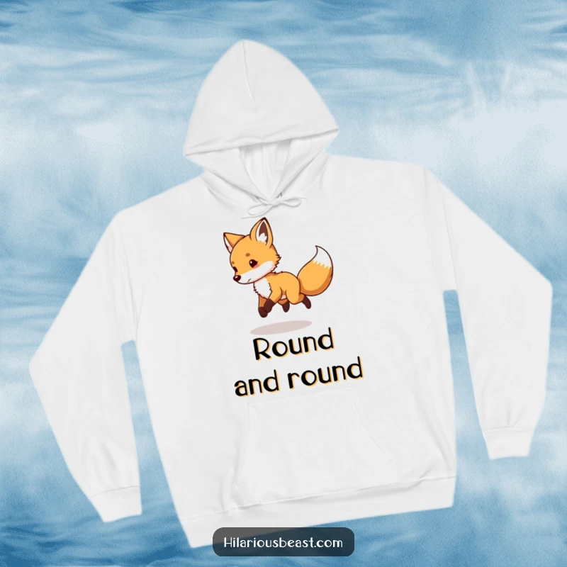 Funny Fox Cub Hoodie: a cozy sweatshirt depicting a playful fox cub spinning in circles chasing its tail.