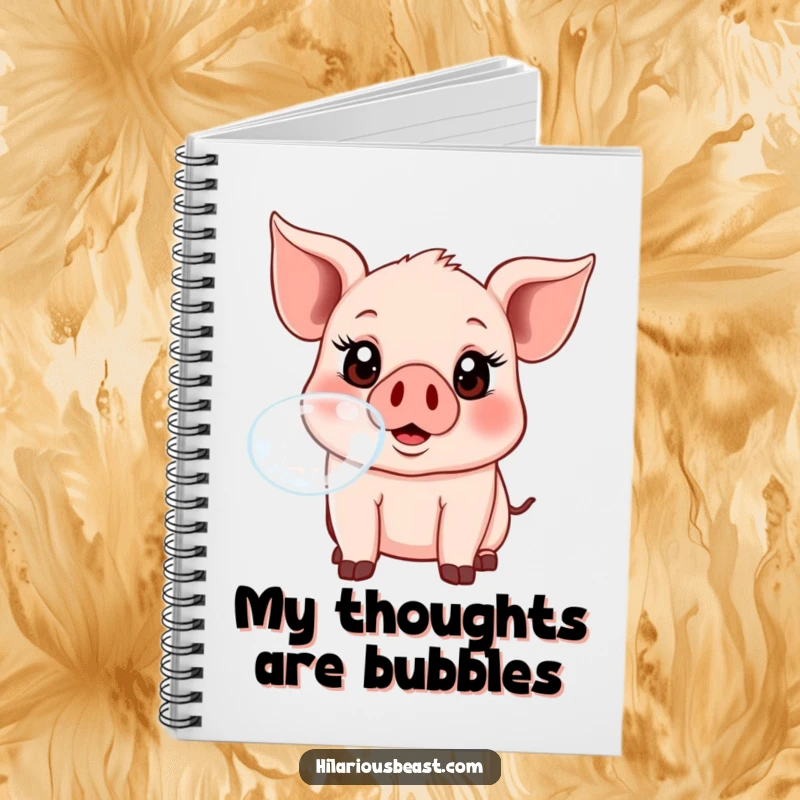 A lined notebook with a cover featuring a funny piglet joyfully blowing a large, iridescent bubble.