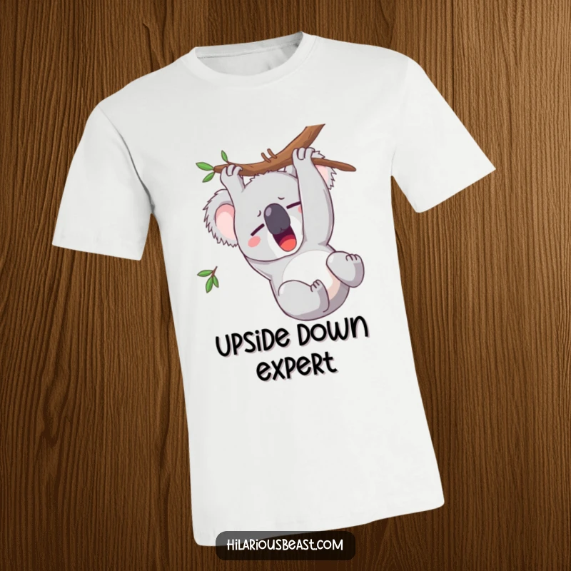 Funny koala t-shirt featuring a sleepy character yawning wide while hanging upside down, a humorous apparel choice.