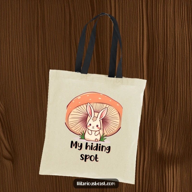 Funny tote bag with a startled rabbit peeking from behind a large, wobbly mushroom, conveying a humorous, surprising encounter.